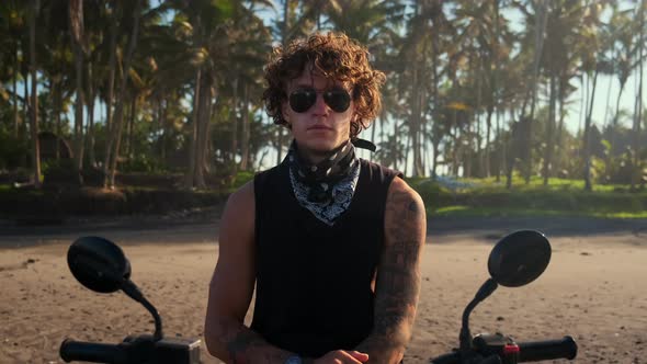 Brutal Biker Portrait on Tropical Beach alt