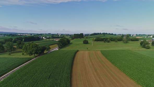 Drone View Passing Thru Smoke and Seeing Amish Farmlands alt