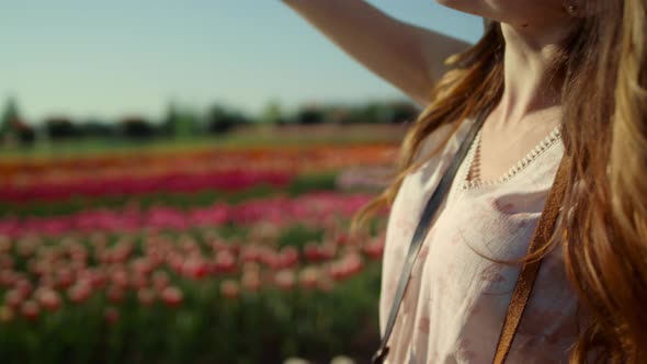 Happy Woman Enjoying Sun in Garden alt