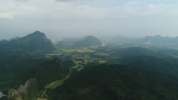 Nature landscape near town of Vang Vieng in Laos seen from the sky alt