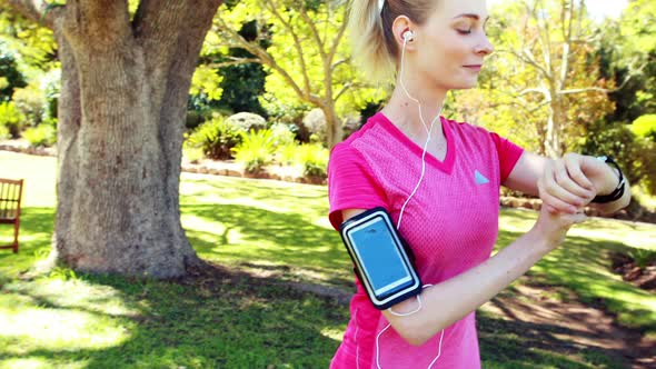 Woman exercising in park alt