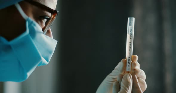 Doctor holding a coronavirus COVID-19 test tube