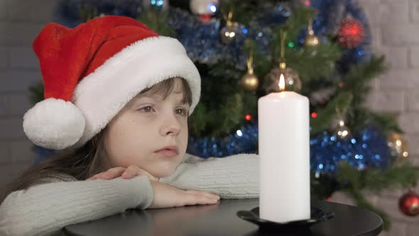 Child Atmospheric Christmas with Candle alt