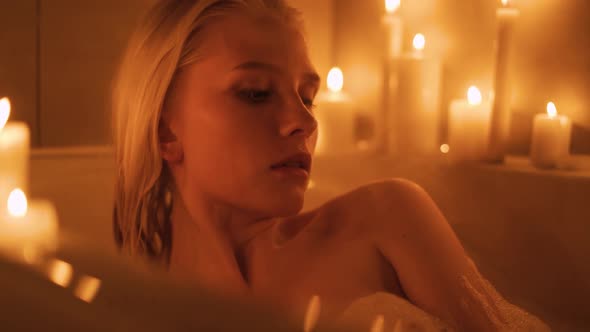 A Woman Lies in a Hot Bath By Candlelight alt