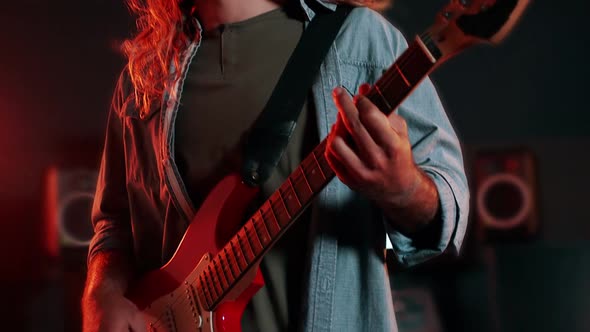 Guitarist wearing virtual reality headset while playing guitar alt