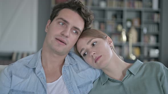 Sad Couple Resting on Head on Shoulder and Thinking alt