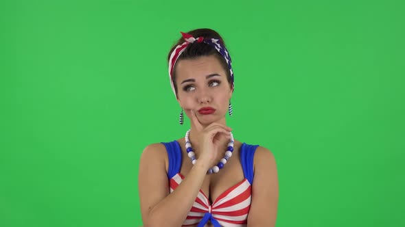 Portrait of Beautiful Girl in a Swimsuit Is Waiting with Boredom. Green Screen alt