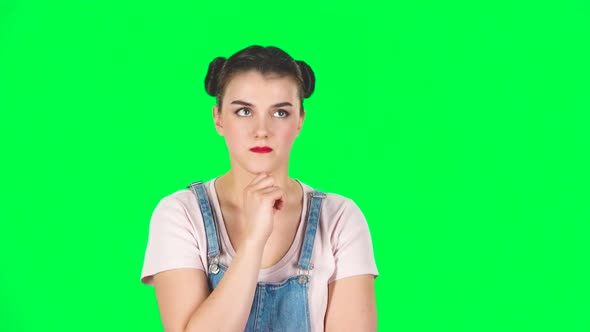 Young Girl Thinks About Something, and Then an Idea Comes To Her, Slow Motion alt