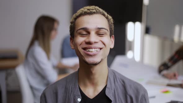Portrait of Happy Businessman Goodlooking Mixed Race Man Standing in Office Looking at Camera alt