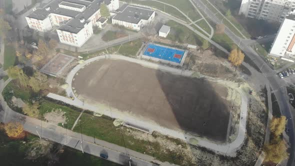 Aerial shot of new built school football stadium