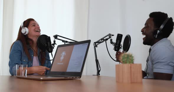 Hosts having podcast session together - Female speaker making an interview during live stream alt