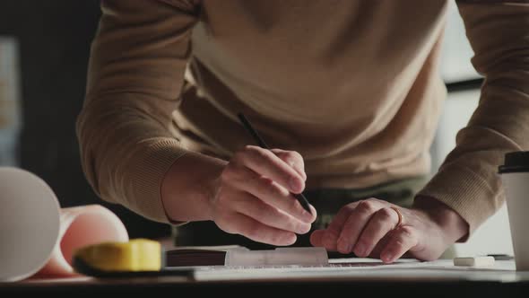 Male Architect at Work, Only Hands with Ruler and Pencil
