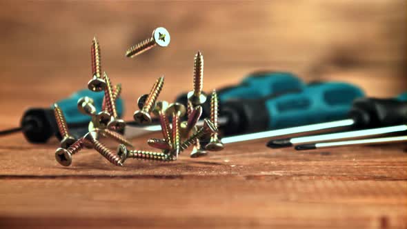 Selftapping Screws Fall on a Wooden Table alt