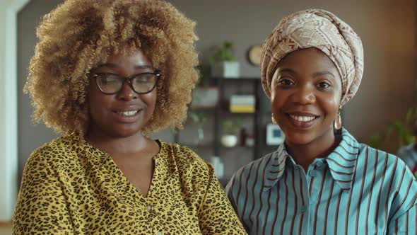 Portrait of Two African American Female Colleagues in Office alt