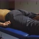Close Up to Male Hands of Masseur Massaging Back of the Thigh to Sportsman in Parlor - VideoHive Item for Sale