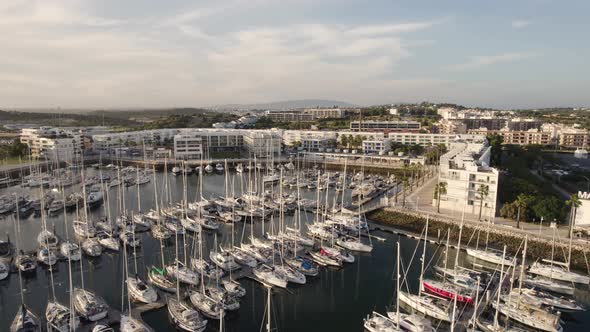 Marina of Lagos full of moored yachts, Algarve, Portugal. Aerial view alt