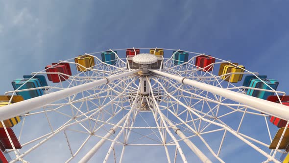 Fun Ferris wheel amusement ride loopable carousel attraction Carnival day. 4K