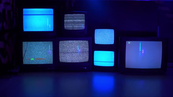 Different Variants of No Signal on Old TV Screens on a Dark Background