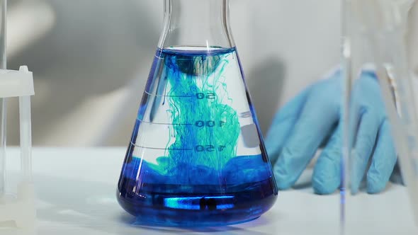 Laboratory Assistant Makes Experiments at Production of Household Chemicals alt