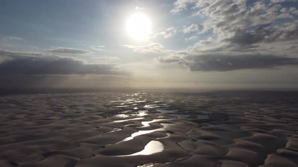 Sunset at Lencois Maranhenses Maranhao. Scenic sand dunes and rainwater lakes alt