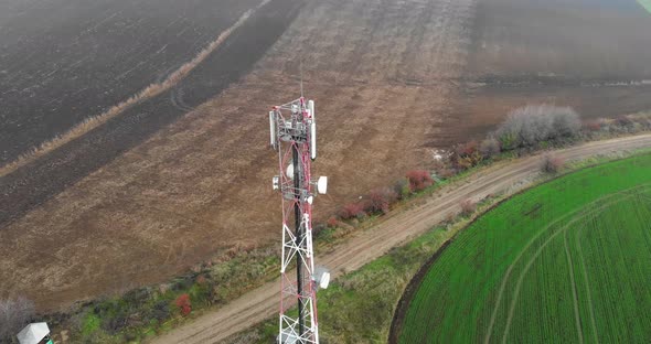 Drone Orbiting At The Relay Tower With Antennas On The Countryside alt