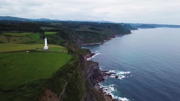 Aerial View of the Lighthouse and Cape Lastres. Bay of Biscay in Northern Spain in Summer
