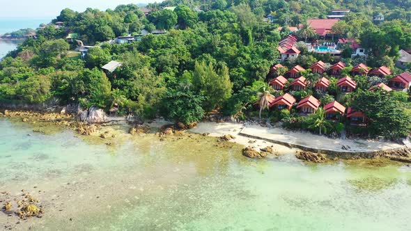 Tropical overhead travel shot of a white paradise beach and aqua blue water background in high resol alt