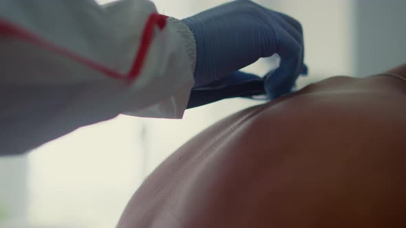 Doctor Hands Listening Lungs with Stethoscope in Infectious Department Closeup alt