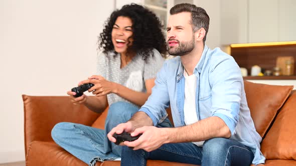 A Multiracial Couple Playing Video Game Together alt