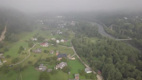 Aerial summer view to Carpathian village Kryvorivnia amidst mountains alt