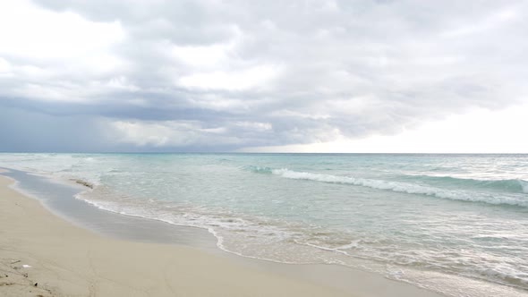 Amazing beach of Varadero Cuba during the day, background tropical storm. alt