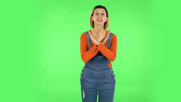 Woman Strictly Gesturing with Hands Crossed Making X Shape Meaning Denial Saying NO. Green Screen alt