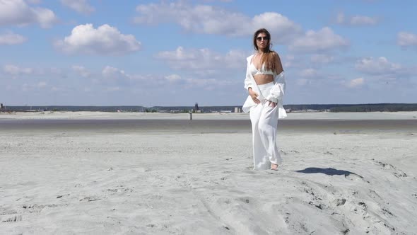 Beautiful Woman Walking on Shore