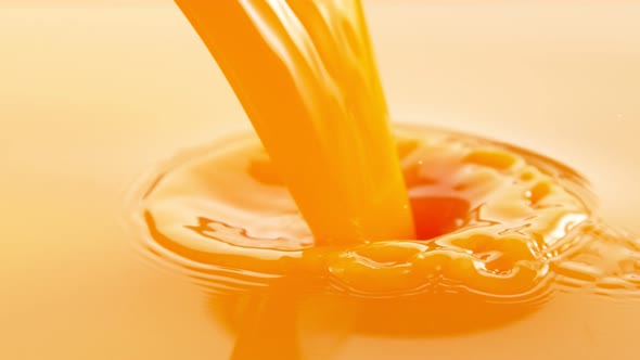 Super Slow Motion Shot of Pouring Fresh Orange Juice at 1000Fps alt