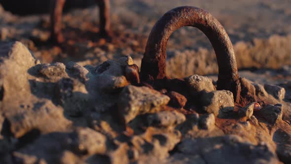 Rusty Metal Sticking Out of a Plate alt