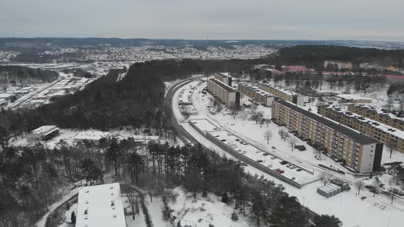 Apartment Buildings on a Hill Winter Time Aerial Reveal