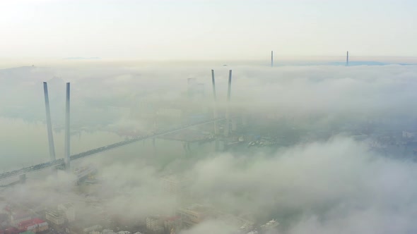 Golden Bridge and Russian Bridge at Dawn Mist in Vladivostok City alt