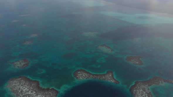 Epic Aerial View of Small Boats Inside Great Blue Hole Marine Sinkhole Belize