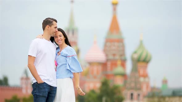 Young Dating Couple in Love Walking in City Background St Basils Church alt