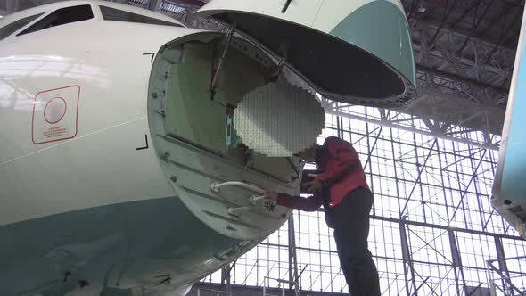 Engineer Repairs Locator Passenger Aircraft alt