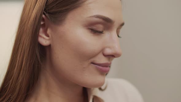 Tired Beautiful Woman Looking Away Takes Off Her Glasses and Massages Her Temples alt