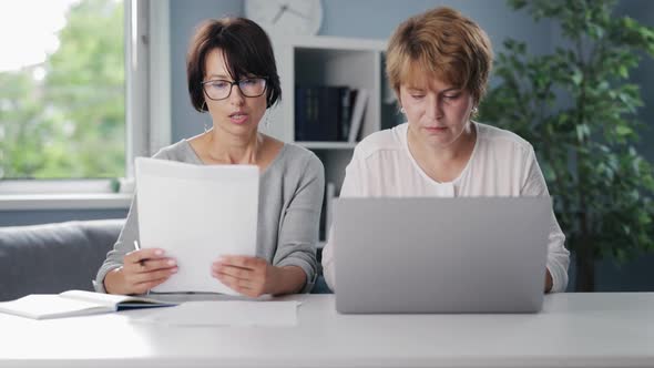 Women Using Laptop for Work