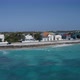 Drone camera fly off coastal area in Cockburn Town, Grand Turk, Turks and Caicos - VideoHive Item for Sale