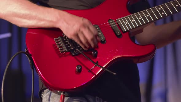 Man Lead Guitarist Playing Electrical Guitar on Concert Stage alt