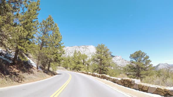POV point of view -Driving through Rocky Mountain National Park in the Spring. alt