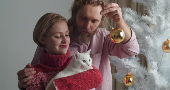 Close-up Portrait Caucasian Couple Young Family Wife and Bearded Husband Holding White Cat alt
