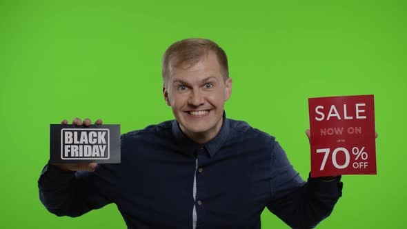 Happy Crazy Store Client. Man Showing Black Friday and Up To 70 Percent Off Inscriptions Signs alt