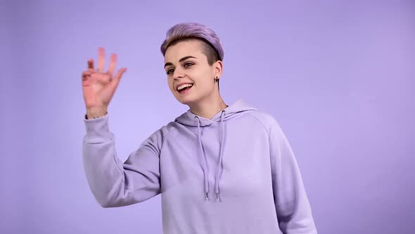 Young Woman Welcoming Gesturing with Hand Beckoning Isolated Indoors alt