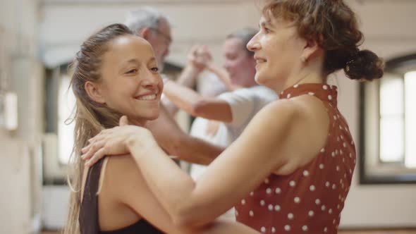 Side View of Woman Rehearsing Waltz with Female Dance Teacher alt