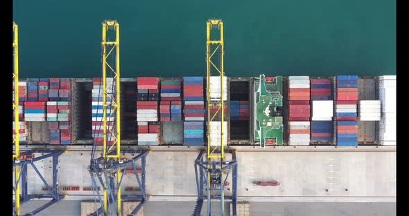 Aerial view from drone of Container , container ship in export and import business and logistics. alt